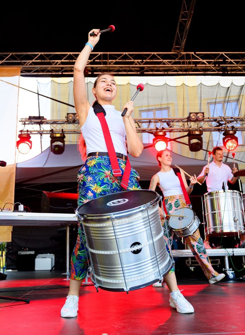 Playing caixa on stage with a Brazilian percussion band